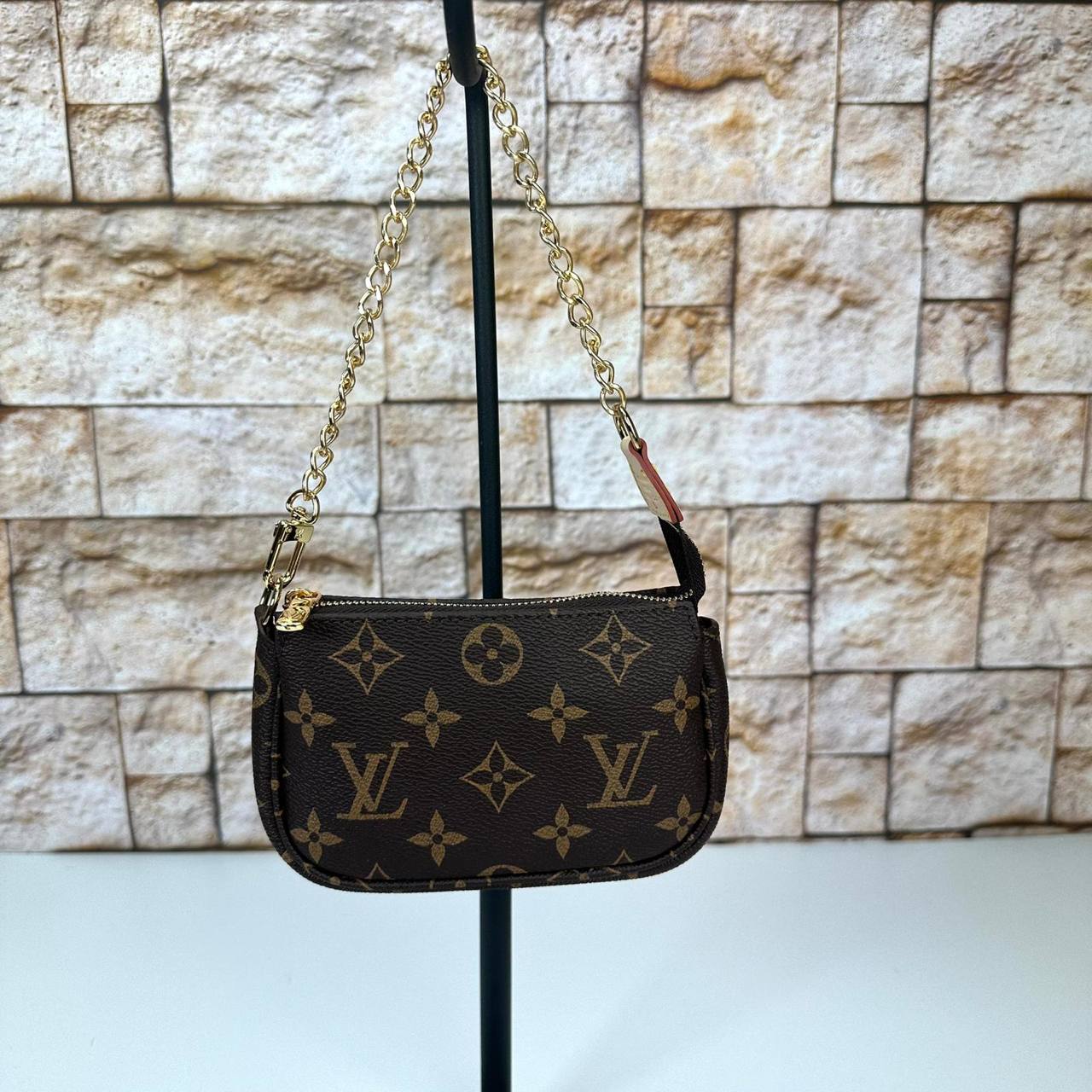 Louis Vuitton Pochette Accessoires Mini Pouch Vivienne Mascot genuine leather women's bag